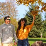 Couple enjoying fall leaves along the River's Edge Trail in Great Falls, Montana